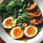 Savory Dumpling Ramen Bowl with Soft-Boiled Eggs and Fresh Greens