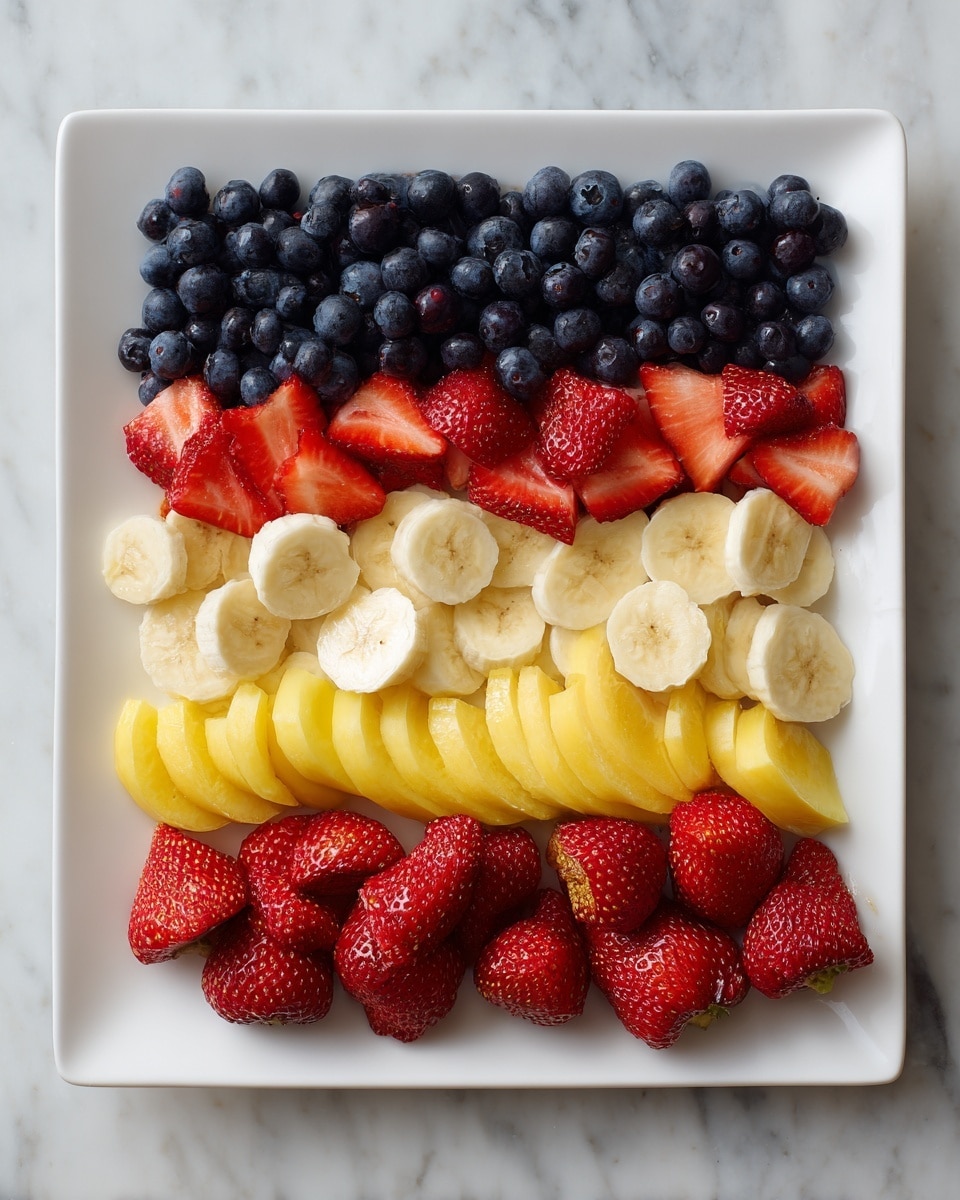 A white square plate sits on a surface with a white marbled texture, filled with layers arranged like a flag. The top left corner has a thick block of fresh dark blue blueberries. Next to this block, the top right corner has two neat rows of banana slices, light yellow with soft texture, with whole and halved bright red strawberries placed above and below the banana rows. Below the blueberries and banana rows, two full horizontal layers of banana slices stretch across the plate. The bottom section of the plate is covered with whole and halved shiny red strawberries, all arranged neatly in rows. photo taken with an iphone --ar 4:5 --v 7