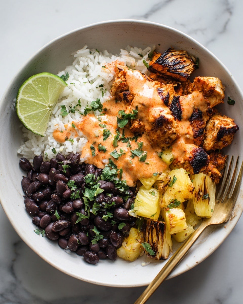 A white bowl filled with four distinct layers: the bottom layer is white rice with a soft texture, the top left layer is black beans with a shiny surface and some red sauce drizzled on top, the top right layer shows grilled onions that are slightly charred, and the main focus is the front center layer of grilled chicken pieces mixed with yellow pineapple chunks, all topped with chopped fresh green cilantro and splashes of red sauce, accompanied by a lime wedge on the side on a white marbled surface photo taken with an iphone --ar 4:5 --v 7