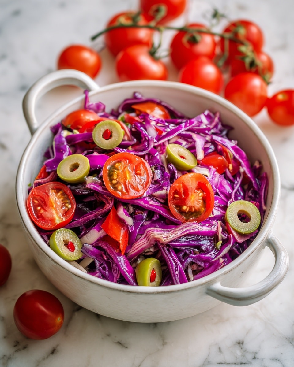 A close-up view of a salad in a white bowl with a blue inside and white handles sitting on a white marbled surface, the salad has thin purple cabbage strips as the main layer, mixed with bright red cherry tomato pieces and sliced green olives evenly spread on top, giving it a fresh and colorful look, some cherry tomatoes and green herbs are casually placed around the bowl adding a natural touch, photo taken with an iphone --ar 4:5 --v 7