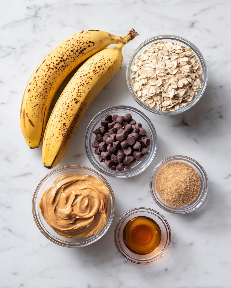 The image shows six ingredients arranged on a white marbled surface. On the left, there are three ripe bananas with brown spots, bright yellow and brown in color. At the top right, there is a clear glass bowl filled with light beige rolled oats. Below it, a smaller clear glass bowl contains dark brown chocolate chips. At the bottom left, another clear glass bowl holds smooth, creamy light brown peanut butter. To the right of it, a larger clear glass bowl is filled with finely ground light brown sugar. In the center bottom, a tiny clear glass bowl shows amber-colored liquid vanilla extract. All items are spaced out neatly with clear bowls, emphasizing the natural colors of the ingredients. photo taken with an iphone --ar 4:5 --v 7