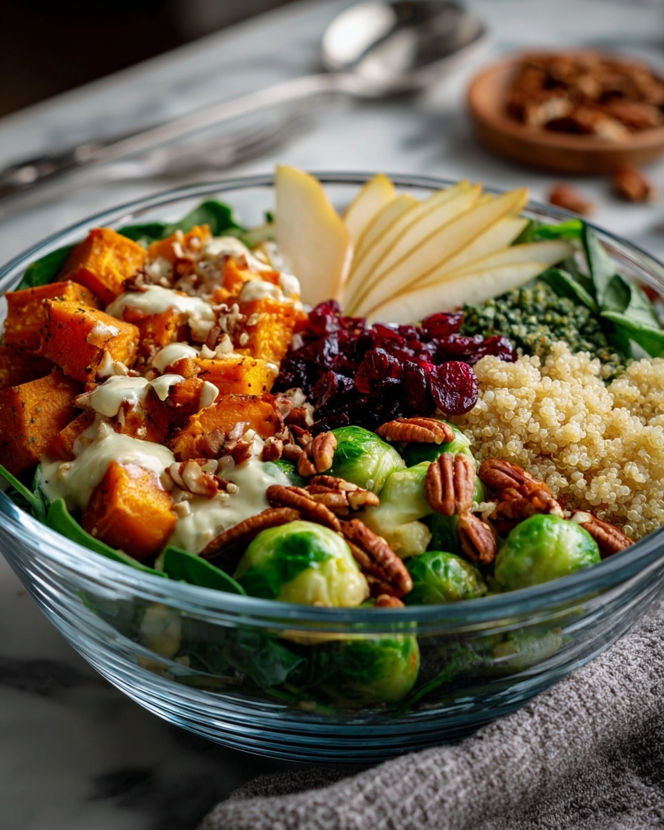 The dish is served in a clear glass bowl on a white marbled surface. The bottom layer is made of green spinach leaves that are barely visible at the edges. On top of the spinach, there are six sections arranged side by side: bright orange sweet potato cubes with a creamy white dressing and pecans sprinkled on them; a fluffy layer of light beige quinoa; dark purple dried cranberries; light tan chickpeas; thin slices of green pear with pecans on top; and roasted green Brussels sprouts with a drizzle of the same creamy dressing. The colors are vibrant, with a mix of soft and firm textures all neatly placed. Photo taken with an iphone --ar 4:5 --v 7