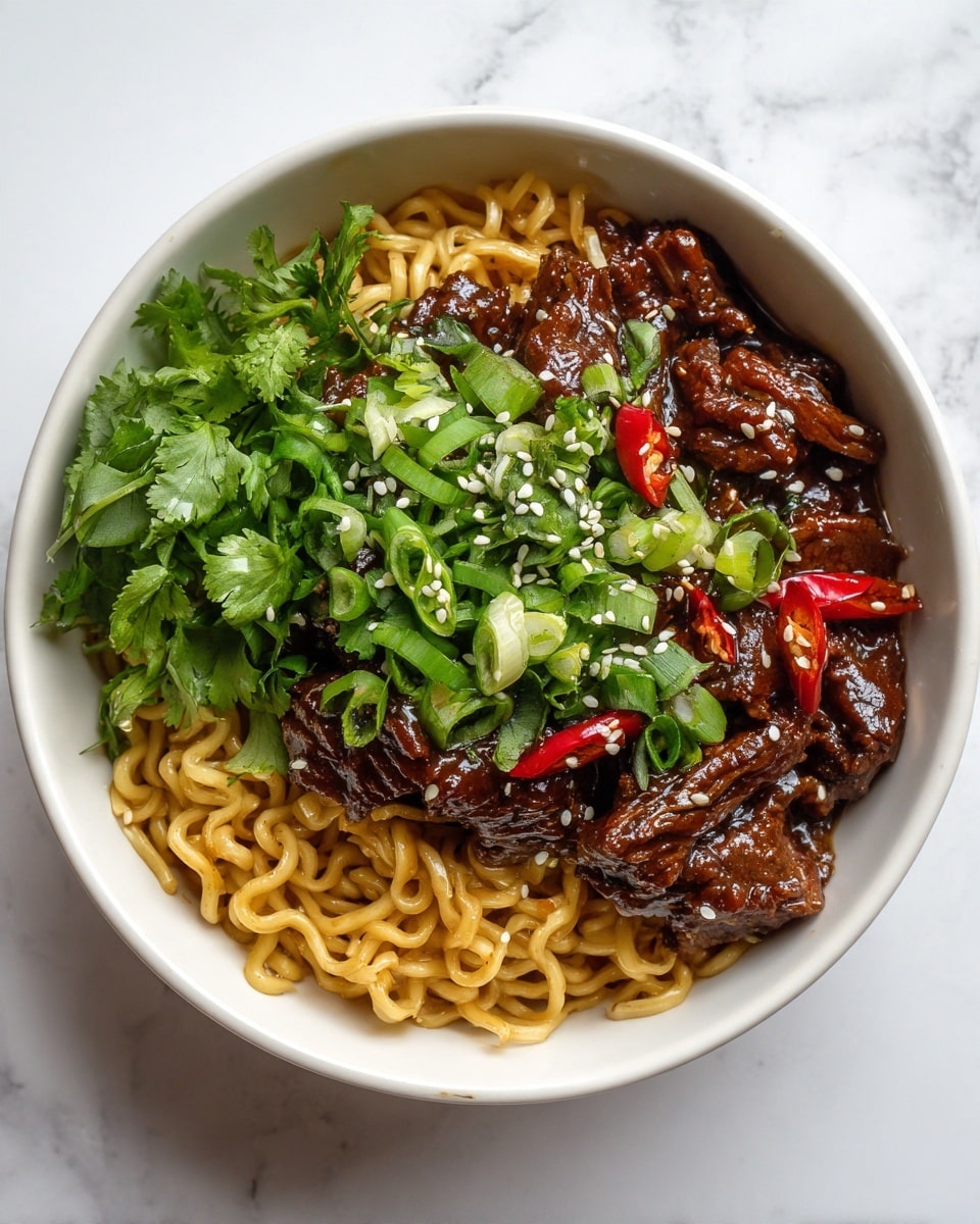 A white bowl filled with three main layers: the bottom layer is golden yellow cooked noodles with a slightly shiny, twisted texture; the middle layer is a mound of dark brown strips of beef in a glossy sauce with small red chili pieces; the top layer is a garnish of fresh green chopped scallions and cilantro leaves sprinkled with white sesame seeds. The background surface is a white marbled texture. Photo taken with an iphone --ar 4:5 --v 7