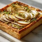 Flaky Puff Pastry Tart with Pears, Goat Cheese, and Pistachios Recipe